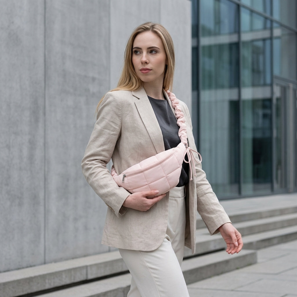 Woman holding a pink bag in an urban setting